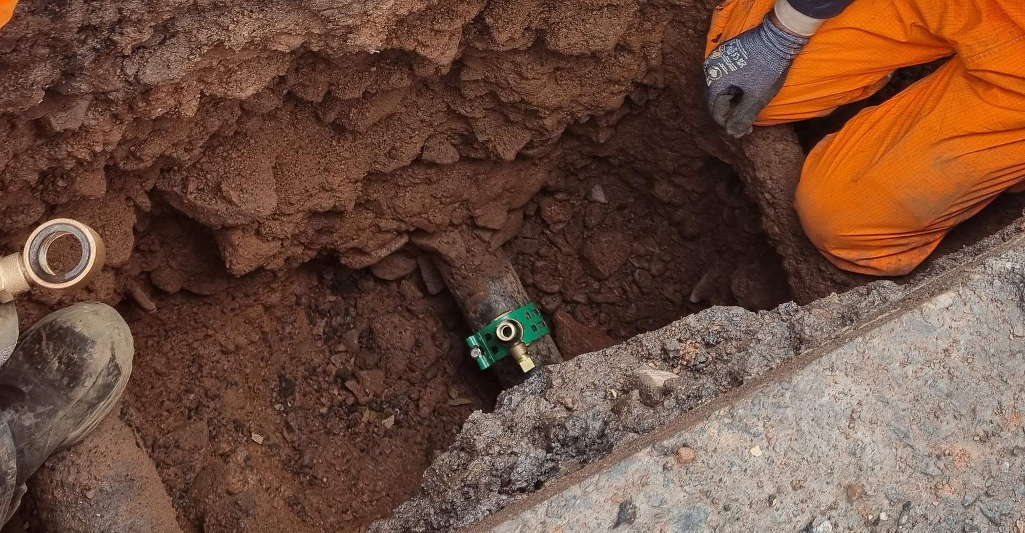 A Waterfit fitting installed on a water main in a service trench